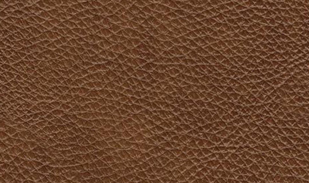 Baskove Leather Sectional In Auburn