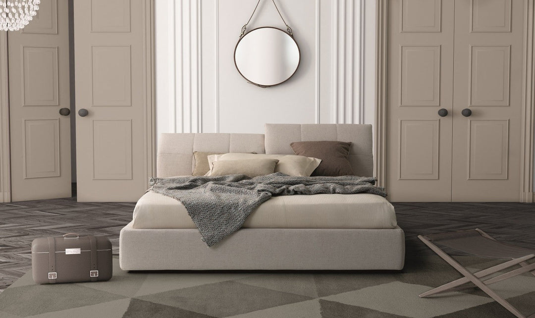 Bedroom with modern bed, dark accent wall, and decor